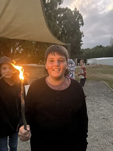 Isaac at toasting (setting fire to) marshmellows