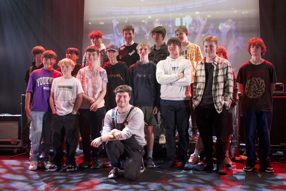 A very proud Mr McNulty with all his students following the RockQuest regional heat 2024