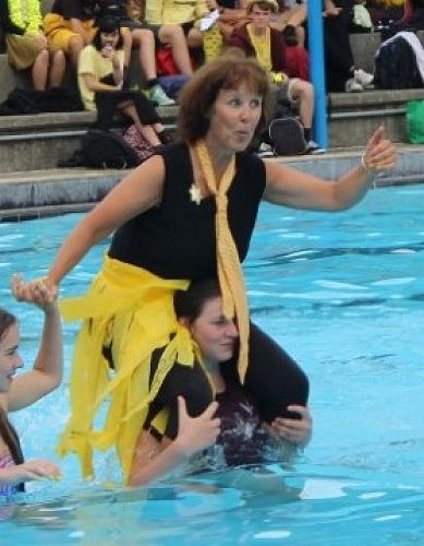 Mrs McDonald gets into the dry carry spirit during Nayland House Day.