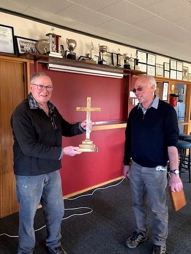 Murry MacEwan, president of the Balfour RSA receives the Balfour altar cross, on behalf of the RSA, from Bill Paterson.