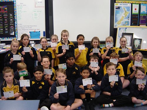 Room 12 showing off their postcards.