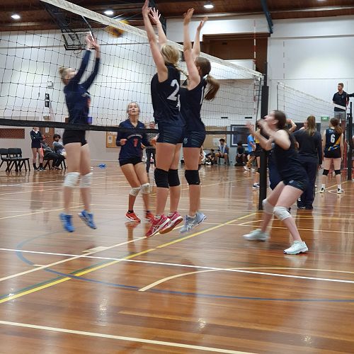 Juniors blocking at the net