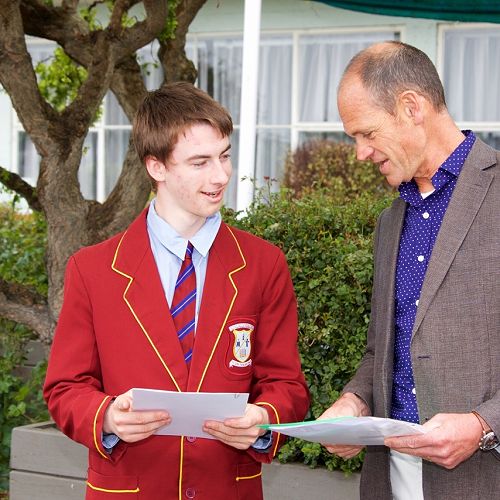 Kit Lloyd, Prime Minister's Vocational Excellence Award winner, is congratulated by Mr Comeau