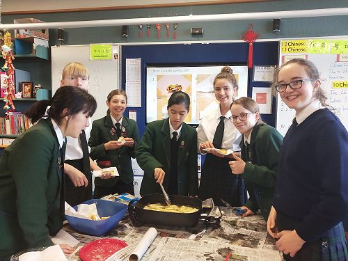 Year 9 students cooking spring rolls