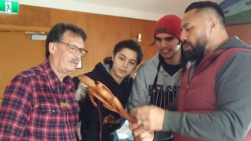 Professor John Broughton (left), Tamati Patuwai (right) with locals checking out Karetao puppets. National Māori Theatre Hui, Puketeraki Marae, 26-29 November 2020. Image 