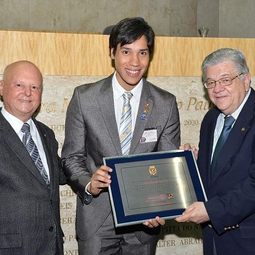 Receiving a recognition by the Sao Paulo City Council for the work done as a DRR by the hands of City Councillor Gilson Barreto and the RI Director 1995-97 José Alfredo Petroni (2018)