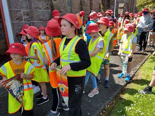 Nearly there: children wait with their pennants to enter the church