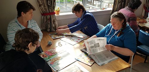 Keeley searching for good photos for Hodge to use