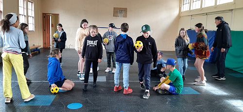 Class 4 and 5 learning how to play Ki-o-raha with Brian