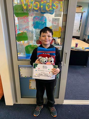 Blake receiving the weekly values award