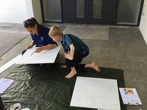 Ariana, Axel discussing artwork