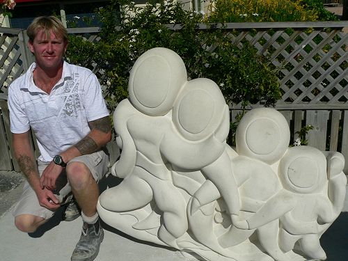 Nathan Finlayson beside his work