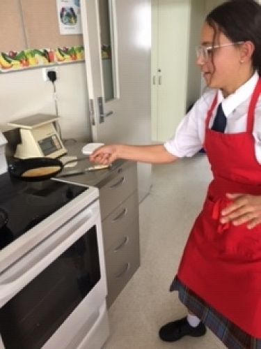Sarah Newton flipping a crepe