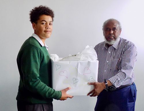 Villi presenting our gift to Mohammed Jama, President of the Mosque.