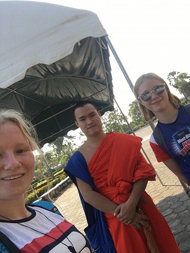 Emma grabs a selfie with a monk.