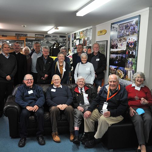 Past staff catch up in the Reynolds Room