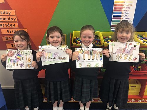 Beatrice Hayde, Claudia Columb, Caitlyn McAuley and Valerie Tagg show off their artworks.