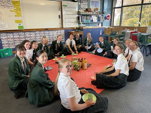 Students enjoying there indoors picnic