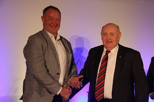 Chancellor Steve Smith presents NZ Rowing Association President John Wylie  with the Sportsperson of the Year award on behalf of Sam Bosworth
