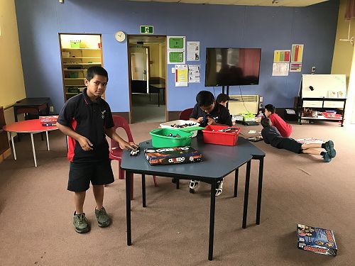 Takai and Siua creating awesome creations with Lego.