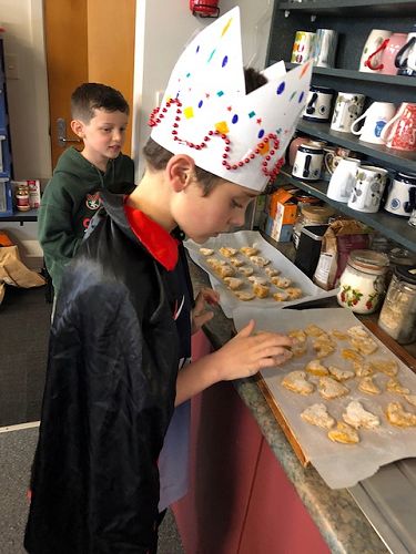 The King is in the staffroom sorting out his dog biscuits