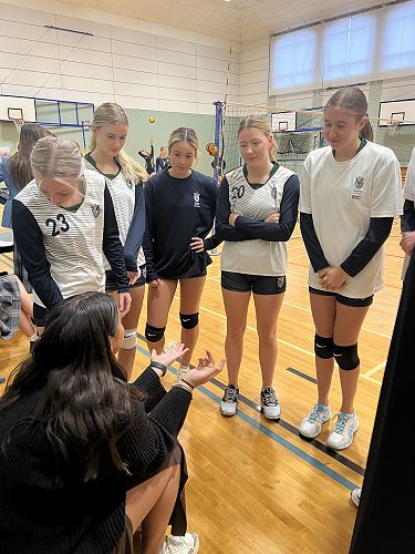 Coach Brianna encourages the team