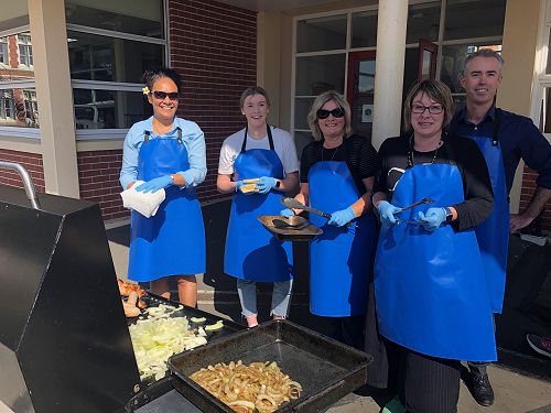 Board members cooking lunch for our students. L-R: Erolia Rooney, Holly Paterson (for mum Nicki Paterson), Jacqui McFadgen, Lyn Hurring and David Smillie.