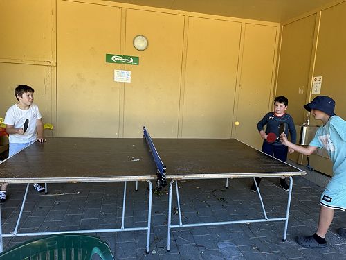 Brody, Xion and Nathaniel enjoying playing table tennis during free time