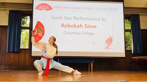 Rebekah performing a Taichi fan dance