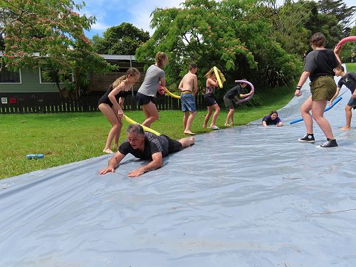 Two of our medical team members sliding into the WIPEOUT course!