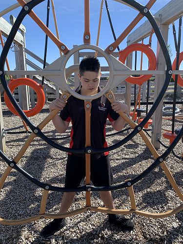 Caleb checking out the interesting climbing frame. 
