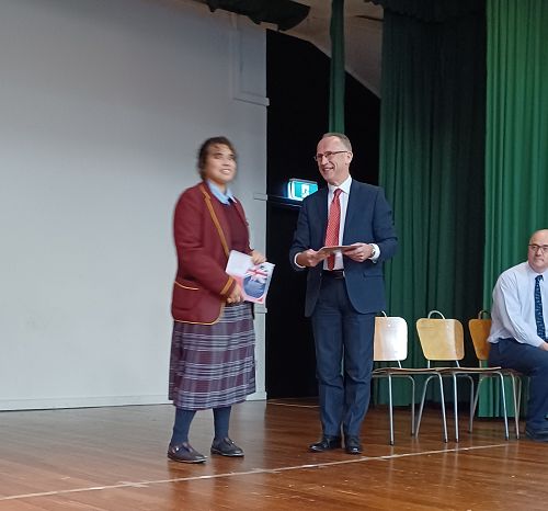 Dorothy receiving her grant from Mr Noble-Campbell