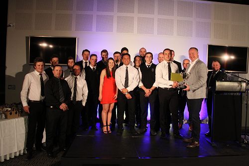 Players and management of the Senior Division One RAMS Rugby team receiving the Chancellors Cup for the Sports Team of the Year from Chancellor Steve Smith
