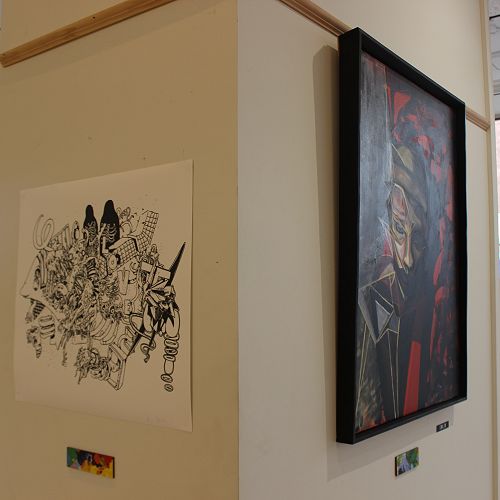 Nick's painting displayed alongside exhibition collborator Daniel van Lith's illustrations, which were chosen to support 'Ecdysis'