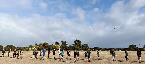 Broadgreen Intermediate and Nayland College students throwing their poi toa as far as they can for teachers to try and catch.