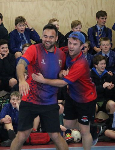 Jonny Leo'o and Jacob Allen embrace ... football!