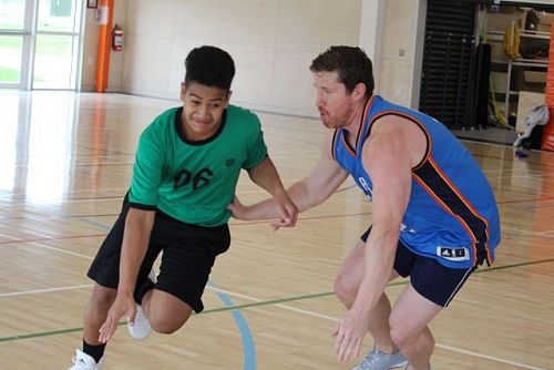 Nick and Ali duking it out on the court.  