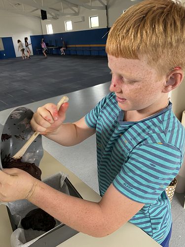Blake loves to cook in the kitchen. Brownie, anyone?