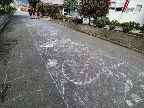 Chalk art on the central driveway.