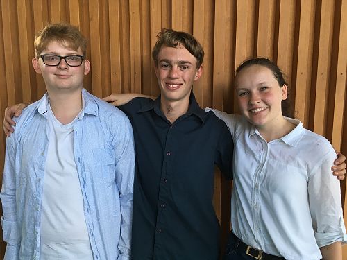 All smiles: the winning senior debating team.