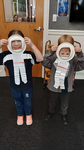 Hazel and Oscar sharing their astronaut