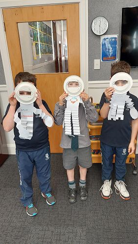 Oliver Acklin, George and Oliver Crayford sharing their astronaut