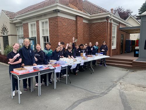 Year 6 children set up and ready to sell!