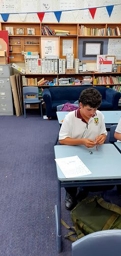 Students making bracelets