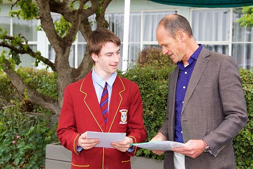 Kit Lloyd, Prime Minister's Vocational Excellence Award winner, is congratulated by Mr Comeau
