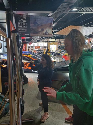 Rylee and Jazmine work as a team on the reaction time challenge