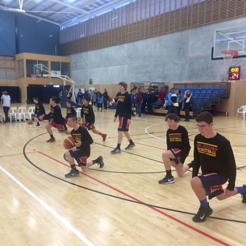 The U/15 A basketball team warming up before a game during tournament week in Nelson.