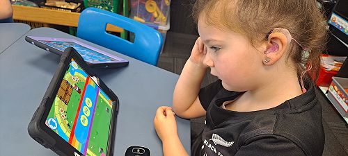 Charlie Livett completes an Ipad literacy activity