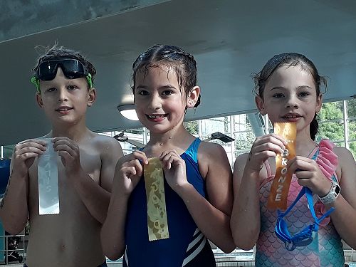 William, Tilly and Ruby on the podium receiving their ribbons.