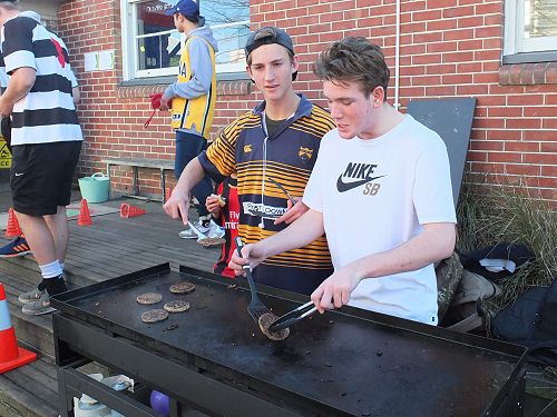 Hudson helping Ryan O'Reilly with the BBQ